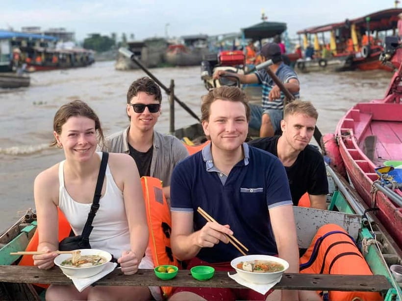 Ho Chi Minh: Group Cai Rang Floating Market 1 Day Tour - Hu Tieu rice vermicelli and pineapple on the boat
