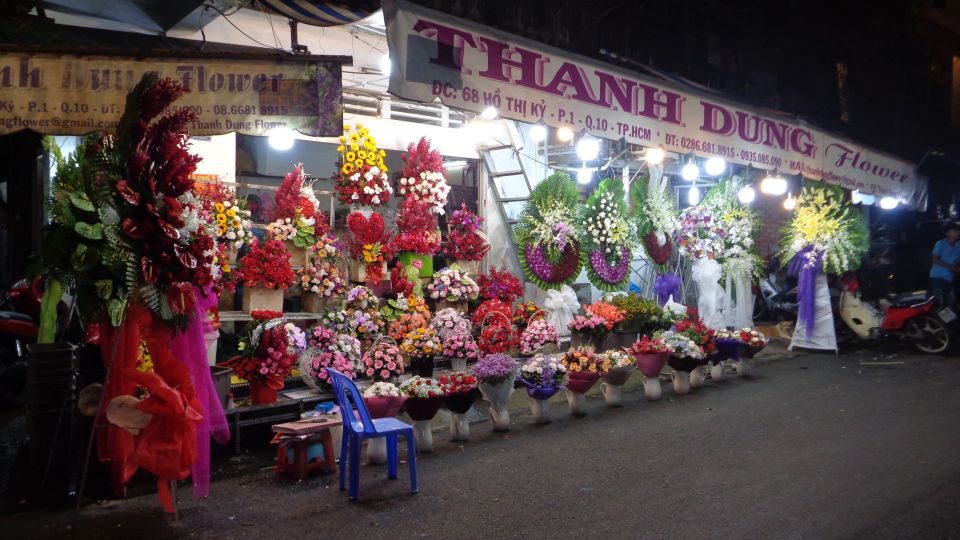 Midnight Street Food Tour In Saigon By Motorbike - Floating market stop: Mekong Delta fruits and the human side of the city
