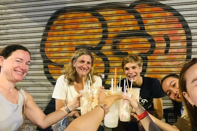 Night Food Tour in Saigon By Scooter - The scooter ride: safety, pacing, and rain gear that actually helps