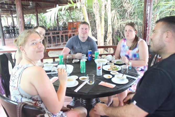 Private Mekong Delta Tour – Boat Ride & Local Lunch - Coconut palms and the slow rowing boat moment
