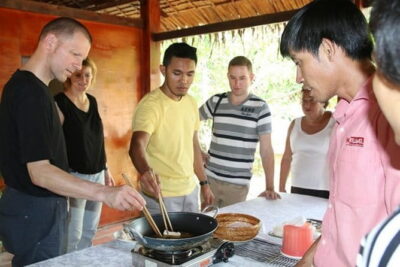 Private Mekong Delta tour to Cai Be – Tan Phong island full day - Coconut Candy, Crispy Rice Popcorn, and Southern Folk Music