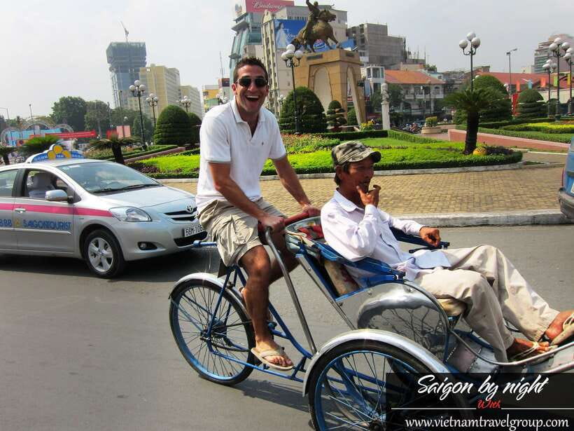 Saigon by Night: Traditional Dinner Cruise - Getting your bearings on a cyclo ride in District 1