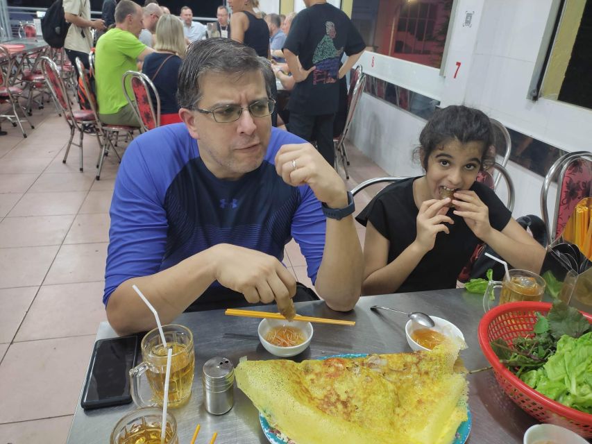 Saigon: Night Sightseeing And Street Food Tour By Vespa - Seafood restaurant finale: seafood, snails, and local beer