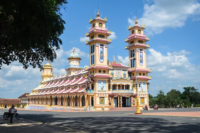 Tay Ninh Holy See - Cable Car & Cu Chi Tunnels | Small Group Tour - Cao Đài Temple Holy See: colorful faith, big symbols, and midday mass