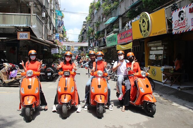 The Insider's Saigon With Female Ao Dai Riders Vespa 4,5 Hours - Cholon and Markets: How to Enjoy the Chaos without Getting Overwhelmed