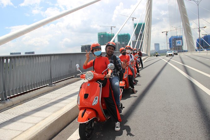 The Insider's Saigon With Female Ao Dai Riders Vespa 4,5 Hours - The Core Route: District 1 Sights and Quick, Clear Stops